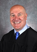 Official portrait of Judge Cameron Blau. 