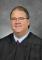 Official portrait of Judge Christopher Cohron. 